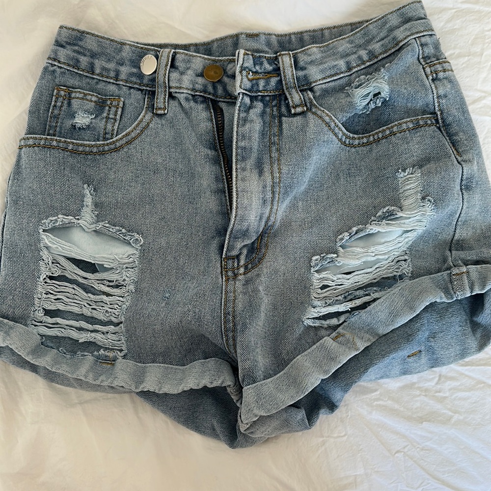 Blue denim distressed jean shorts (comes with extra button)